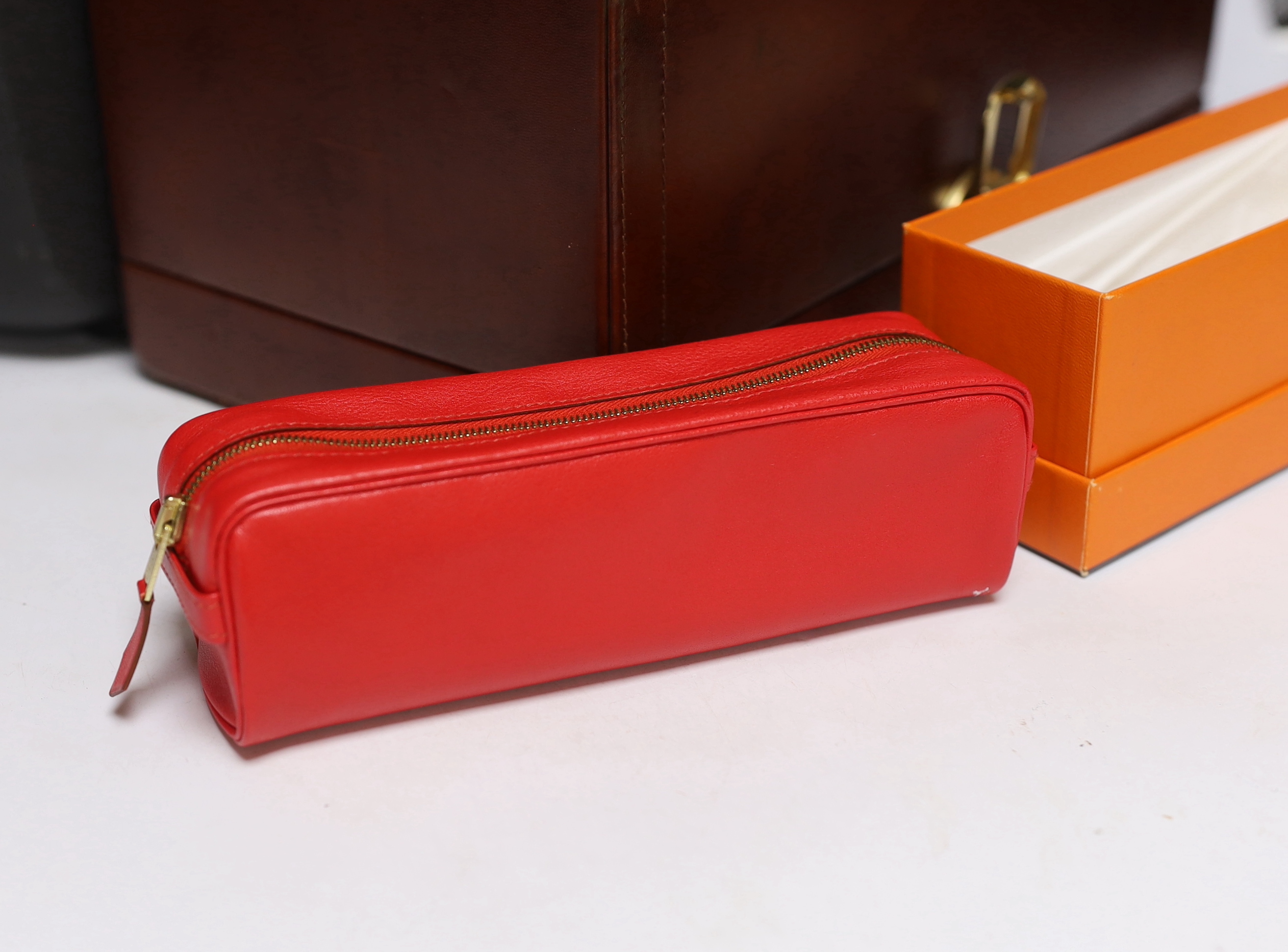 Hermes boxed red leather pen case, a Samsonite black hard plastic overnight case and a brown leather vanity/jewllery case, largest 34cm high
